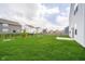 Spacious backyard with lush green grass and well-maintained landscaping, perfect for outdoor activities at 8654 Tripp Rd, Pendleton, IN 46064