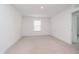 Minimalist bedroom with neutral carpet, bright lighting and a window at 8654 Tripp Rd, Pendleton, IN 46064