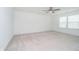 Large bedroom offering neutral carpet, fan, and natural light at 8654 Tripp Rd, Pendleton, IN 46064
