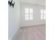 Bedroom featuring large windows with shutters, creating a bright and airy space at 8654 Tripp Rd, Pendleton, IN 46064