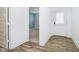 Inviting entryway with wood-look flooring and a view into a room with stylish, blue accent wall at 8654 Tripp Rd, Pendleton, IN 46064