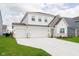 Beautiful two-story home featuring a three-car garage and a meticulously maintained front yard at 8654 Tripp Rd, Pendleton, IN 46064