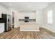 Modern kitchen featuring a center island, stainless steel appliances, and a stylish backsplash at 8654 Tripp Rd, Pendleton, IN 46064