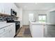 Modern kitchen features stainless steel appliances and tiled backsplash at 8654 Tripp Rd, Pendleton, IN 46064