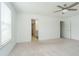 Bright main bedroom with neutral carpet and ensuite bathroom entrance at 8654 Tripp Rd, Pendleton, IN 46064