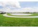 A pond with a walking path in a beautifully landscaped community at 8654 Tripp Rd, Pendleton, IN 46064
