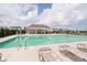 Community pool featuring lounge chairs and an open air pavilion for residents at 8654 Tripp Rd, Pendleton, IN 46064