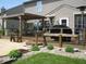 Backyard deck area featuring a pergola, outdoor seating, and a grill at 9045 Stones Bluff Pl, Indianapolis, IN 46113
