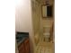 A clean bathroom featuring a tub with shower, toilet, cabinet and a mirror at 9045 Stones Bluff Pl, Indianapolis, IN 46113