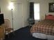 Bedroom with bed, closet, and chair at 9045 Stones Bluff Pl, Indianapolis, IN 46113