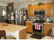 Spacious kitchen with stainless steel appliances, ample counter space, and tile backsplash at 9045 Stones Bluff Pl, Indianapolis, IN 46113