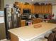 Well-equipped kitchen featuring stainless steel appliances, ample counter space, and wooden cabinets at 9045 Stones Bluff Pl, Indianapolis, IN 46113