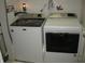 Efficient laundry area with modern front-loading washer and dryer at 9045 Stones Bluff Pl, Indianapolis, IN 46113
