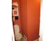 Compact powder room features a toilet and a small cabinet for storage at 9045 Stones Bluff Pl, Indianapolis, IN 46113