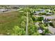 A scenic aerial view of a neighborhood lined with trees, homes, and a walking trail at 9099 Merrill Ct, Fishers, IN 46038