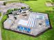 Aerial view of a community pool with lap lanes, sun shades and ample lounge areas at 9099 Merrill Ct, Fishers, IN 46038