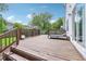 Outdoor back deck with wood railing and ample space for entertaining at 9099 Merrill Ct, Fishers, IN 46038