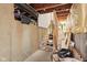 Unfinished basement with exposed utilities, stairs, and concrete walls at 9099 Merrill Ct, Fishers, IN 46038