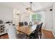 Elegant dining room with modern lighting, a rustic wooden table, and comfortable seating for Gathering gatherings at 9099 Merrill Ct, Fishers, IN 46038
