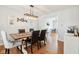 Open-concept dining room featuring a rustic table with modern accents, creating a welcoming space for dining and entertaining at 9099 Merrill Ct, Fishers, IN 46038