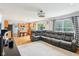 Spacious living room with plush seating, natural light, and an open layout that flows seamlessly into the adjacent kitchen area at 9099 Merrill Ct, Fishers, IN 46038
