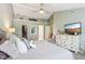A spacious main bedroom featuring vaulted ceilings, a dresser, and access to a walk-in closet and bathroom at 9099 Merrill Ct, Fishers, IN 46038