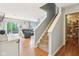 Carpeted staircase leading to the second floor, with a view of the living room and access to a pantry or storage area at 9099 Merrill Ct, Fishers, IN 46038