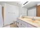 A bright bathroom boasts a double vanity with modern fixtures and ample counter space at 9467 Sandpiper W Dr, Indianapolis, IN 46268