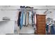 A spacious walk-in closet features ample storage with hanging rods and a dresser, creating an organized space at 9467 Sandpiper W Dr, Indianapolis, IN 46268