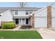 Townhouse with well-manicured lawn and attached garage; unit number 9467 at 9467 Sandpiper W Dr, Indianapolis, IN 46268