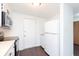 Efficient kitchen layout with white appliances, plenty of cabinet storage and exterior door access at 9467 Sandpiper W Dr, Indianapolis, IN 46268