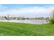 Scenic view of a calm lake surrounded by well-maintained community residences at 9467 Sandpiper W Dr, Indianapolis, IN 46268