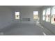 Bright living room featuring large windows and a fireplace, offering a comfortable and inviting space at 10145 Redwood Peak Ln, Indianapolis, IN 46259