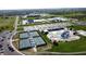 Aerial view of water park with tennis court, parking, and neighborhood at 1051 Margate Dr, Greenwood, IN 46143