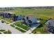 Gorgeous aerial view of a home with meticulous landscaping and a three-car garage in a Gathering-friendly neighborhood at 1051 Margate Dr, Greenwood, IN 46143