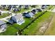 Expansive aerial view showcasing the home's backyard with a pool, lush lawn, and neighborhood setting at 1051 Margate Dr, Greenwood, IN 46143
