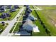 Overhead view of a home with a pool and deck, nestled in a neighborhood with tree-lined streets and green spaces at 1051 Margate Dr, Greenwood, IN 46143