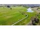 Aerial view of a green park area with walking paths and benches, providing an outdoor recreational space at 1051 Margate Dr, Greenwood, IN 46143