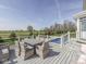 Relaxing outdoor deck featuring dining and lounge space overlooking greenery at 1051 Margate Dr, Greenwood, IN 46143