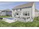 Spacious backyard showcases a modern pool, a well-appointed deck for entertaining, and ample green space at 1051 Margate Dr, Greenwood, IN 46143