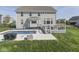 Relaxing backyard features a pool with fountains, a deck with outdoor seating, and a well-maintained lawn at 1051 Margate Dr, Greenwood, IN 46143