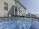 Unique perspective of a backyard pool with fountain features, perfect for a refreshing dip on a sunny day at 1051 Margate Dr, Greenwood, IN 46143