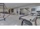 Spacious finished basement featuring a game area, home office, and staircase access at 1051 Margate Dr, Greenwood, IN 46143