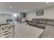 Finished basement featuring a large sectional couch, gaming area and dining area at 1051 Margate Dr, Greenwood, IN 46143