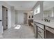 Bright bathroom featuring double vanities, a walk-in shower with glass door, and neutral color palette at 1051 Margate Dr, Greenwood, IN 46143