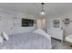 Bedroom featuring plank flooring, modern chandelier, and plenty of decorations at 1051 Margate Dr, Greenwood, IN 46143
