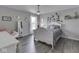 Bedroom featuring plank flooring, modern chandelier, and plenty of decorations at 1051 Margate Dr, Greenwood, IN 46143