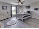 Sports themed bedroom featuring plank flooring, baseball decorations, and plenty of light at 1051 Margate Dr, Greenwood, IN 46143