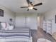 Bright bedroom with baseball theme, ceiling fan, and wood-look flooring offers comfort and style at 1051 Margate Dr, Greenwood, IN 46143