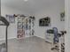 Bedroom featuring a wall display, television, neutral paint, and an organized storage area at 1051 Margate Dr, Greenwood, IN 46143